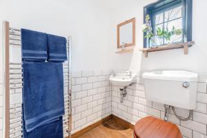 a bathroom with a toilet and a sink at 1 Bed in Swanage oc-l30493 in Langton Matravers +7 photos