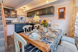 a dining room with a table and chairs and a kitchen at 3 Bed in Sennen Cove oc-c29670 in Sennen +15 photos