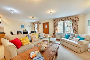 a living room with two couches and a coffee table at 1 Bed in Beadnell oc-l29758 in Beadnell