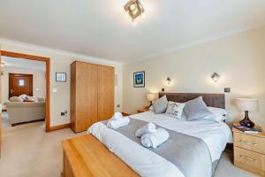 a bedroom with a large bed with towels on it at 1 Bed in Beadnell oc-l29758 in Beadnell
