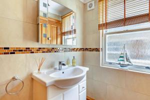 a bathroom with a sink and a window at 1 Bed in Beadnell oc-l29758 in Beadnell +18 photos