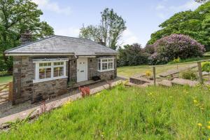 a small stone cottage in the middle of a field at 1 Bed in Brynteg oc-g32079 in Llanwenog