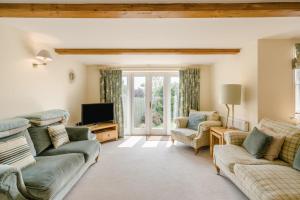 a living room with two couches and a tv at 3 Bed in West Lulworth oc-s32114 in West Lulworth