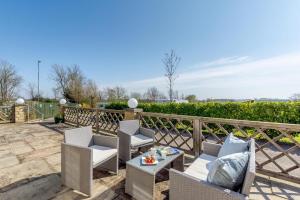 a patio with chairs and a table and a fence at 1 Bed in Wombleton oc-m31864 in Nunnington