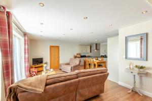 a living room with a couch and a kitchen at 1 Bed in Wombleton oc-m31864 in Nunnington