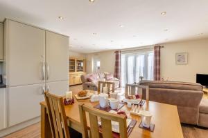 a kitchen and living room with a table and chairs at 1 Bed in Wombleton oc-m31864 in Nunnington
