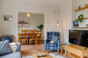 a living room with a couch and chairs and a table at 3 Bed in Ashbourne oc-e27970 in Ashbourne