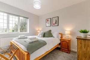 a bedroom with a bed with two towels on it at 3 Bed in Ashbourne oc-e27970 in Ashbourne