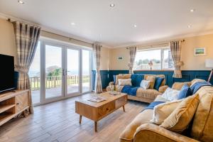 a living room with a couch and a tv at 1 Bed in Llanover oc-y30114 in Llanover
