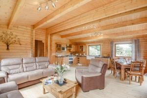 a living room with a couch and a table at 3 Bed in Llanddulas oc-r27872 in Llanddulas