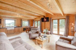 a living room with couches and a table at 3 Bed in Llanddulas oc-r27872 in Llanddulas