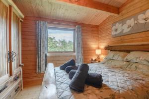 a bedroom with a bed in a wooden cabin at 3 Bed in Llanddulas oc-r27872 in Llanddulas