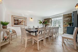 a dining room with a table and chairs at 7 Bed in St. Agnes oc-p28968 in St. Agnes +23 photos