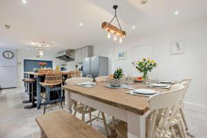 a kitchen and dining room with a table and chairs at 7 Bed in St. Agnes oc-p28968 in St. Agnes