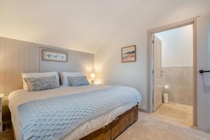 a bedroom with a large bed and a walk in shower at 2 Bed in Lancing oc-t29902 in Lancing