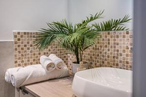 a bathroom with a sink and a plant on a counter at 2 Bed in Lancing oc-t29902 in Lancing +18 photos