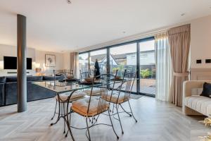 a dining room and living room with a glass table and chairs at 2 Bed in Lancing oc-t29902 in Lancing