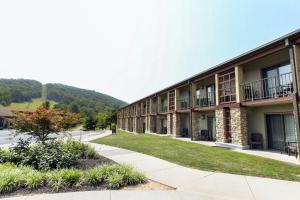 a building with balconies and grass in front of it at Liberty Mountain Lodging by Vail Resorts in Fairfield