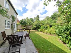 a patio with a table and chairs in a yard at 2 Bed in Chilmark oc-w32753 in Chilmark