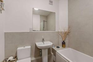 a bathroom with a sink and a toilet and a mirror at 2 Bed in Belford oc-c29288 in Fenham +20 photos