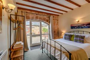 a bedroom with a bed and a large window at 2 Bed in Belford oc-c29288 in Fenham