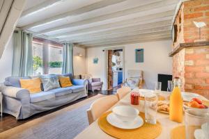 a living room with a couch and a table at 2 Bed in Sheringham oc-2310 in Sheringham