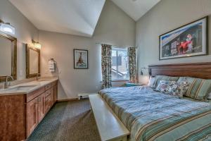 a bedroom with a large bed and a sink at Kirkwood Mountain Resort by Vail Resorts in Kirkwood +133 photos