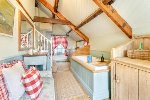 a kitchen with a couch and a sink in a room at 6 Bed in Llanfilo oc-e30630 in Llandefalle +34 photos