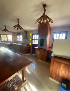 a large room with a kitchen with a table at Casona de Montaña in Los Hornillos
