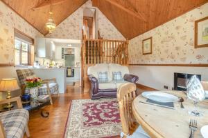 a kitchen and living room with a table and chairs at 2 Bed in Devils Bridge oc-d29575 in Devils Bridge