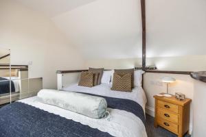 a bedroom with two beds and a night stand at 1 Bed in Toynton All Saints oc-s29840 in Toynton All Saints