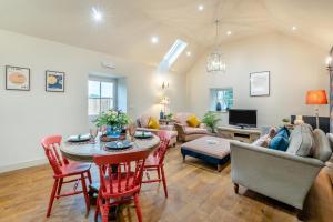 a living room with a table and a couch at 2 Bed in Wycliffe oc-r29947 in Wycliffe