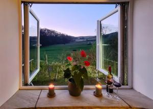 a window with candles and a vase with flowers in it at 4 Bed in Little Hayfield oc-c31097 in Hayfield +8 photos