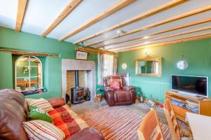 a living room with a couch and a fire place at 1 Bed in Starkholmes oc-q30994 in Matlock Bank