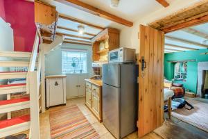 a kitchen with a refrigerator and wooden walls at 1 Bed in Starkholmes oc-q30994 in Matlock Bank