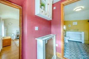 a bathroom with a pink wall and a toilet at 1 Bed in Starkholmes oc-q30994 in Matlock Bank +18 photos