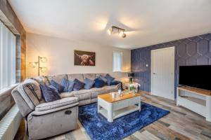 a living room with a couch and a tv at 3 Bed in Rhyl oc-p30593 in Rhyl