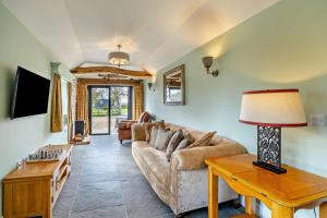 a living room with a couch and a table at 1 Bed in Saltfleetby oc-b30073 in Saltfleetby Saint Peter
