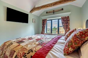 a bedroom with a bed and a large window at 1 Bed in Saltfleetby oc-b30073 in Saltfleetby Saint Peter