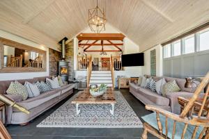 a living room with couches and a table at 5 Bed in St. Issey oc-r4328 in Saint Issey