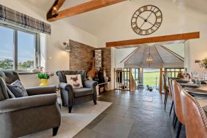 a living room with a large clock on the wall at 5 Bed in St. Issey oc-r4328 in Saint Issey