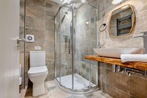 a bathroom with a shower and a toilet and a sink at 5 Bed in St. Issey oc-r4328 in Saint Issey +32 photos