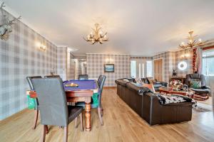 a living room with a table and a couch at 4 Bed in Lochgoilhead oc-j30107 in Carrick