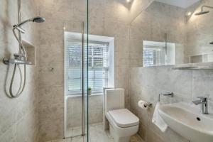 a bathroom with a shower and a toilet and a sink at 2 Bed in Cornhill-on-Tweed oc-d30765 in Cornhill-on-tweed +16 photos