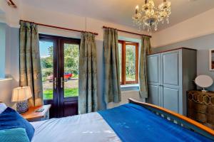 a bedroom with a bed and a window at 5 Bed in Dymchurch oc-w30161 in Dymchurch