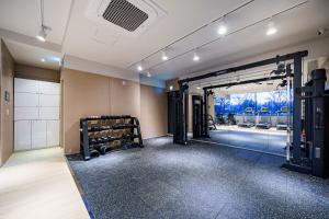 a room with a gym with a large doorway at Daegu Hound Hotel Dongchon Amusement Park in Daegu