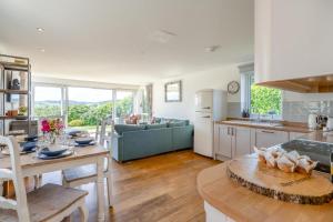 a kitchen and living room with a table and a couch at 3 Bed in Newburgh oc-h32592 in Newburgh