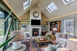 a living room with a vaulted ceiling with skylights at 3 Bed in Scarfskerry oc-o30016 in Scarfskerry
