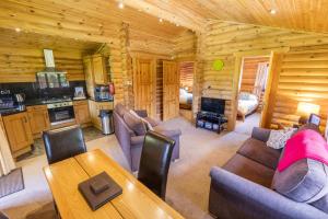 a living room and kitchen in a log cabin at 2 Bed in Felton oc-c30643 in Felton