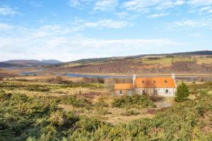 an old house in the middle of a field at 2 Bed in Ardgay oc-w30780 in Achnahanat